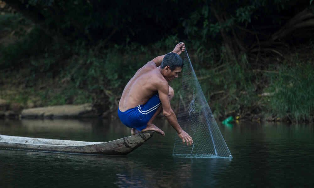 Man fishing in Banchaung river, Myanmar.