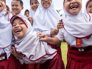 children gathered for mobile education unit in Sumatra