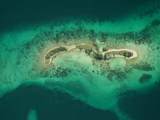 Laughing Bird Caye National Park Aerial view of coral reef from 6,000 ft. Belize