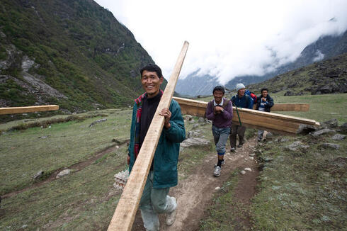 Men carrying wood in Nepal