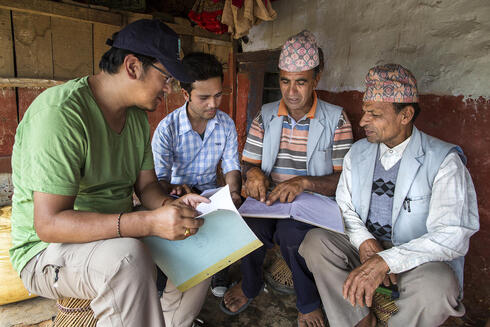 Community leaders in Nepal having a discussion