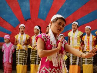 Community members in Souther Myanmar participate in a Karen traditional dance