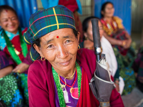 A community member attending the community meeting held at the rebuilt Jivanjyoti Lower Secondary School in the Gorkha District of Nepal.