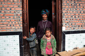 Family participates in energy efficient cookstove project in Liangshan, China