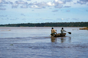 people in dugout canoe, Amazon, Peru